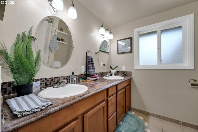 1364 Goodpasture Island Rd, Eugene, OR 97401 - bathroom featuring tile patterned flooring, double vanity, tasteful backsplash, and baseboards