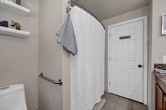 1364 Goodpasture Island Rd, Eugene, OR 97401 - full bath featuring tile patterned flooring, vanity, toilet, and a shower with shower curtain