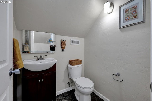 1364 Goodpasture Island Rd, Eugene, OR 97401 - bathroom with vanity, toilet, lofted ceiling, and baseboards