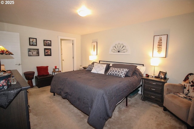bedroom featuring light colored carpet