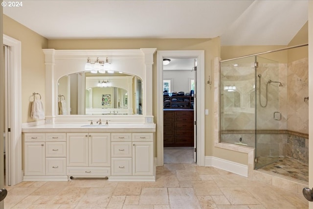 bathroom featuring walk in shower and vanity