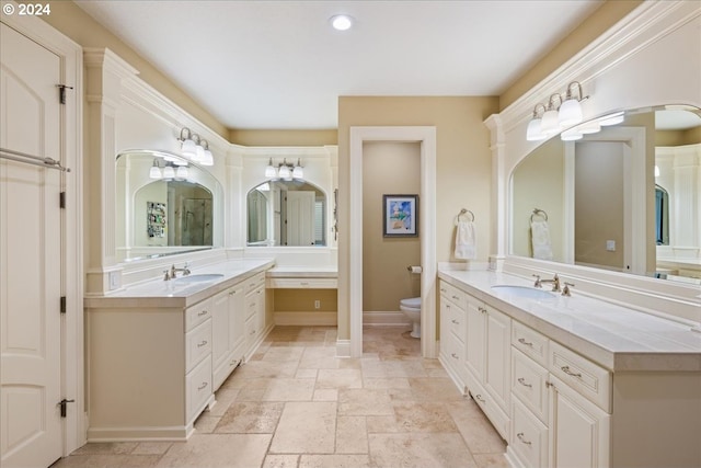 bathroom featuring toilet and vanity