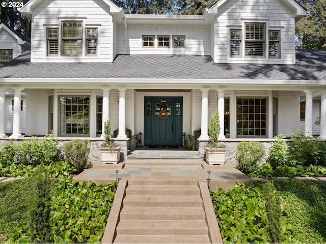 view of exterior entry featuring a porch