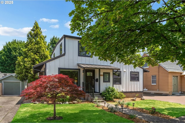 6126 SE 23rd Ave, Portland, OR 97202 - view of front of house with board and batten siding, a front yard, a standing seam roof, an outdoor structure, and driveway