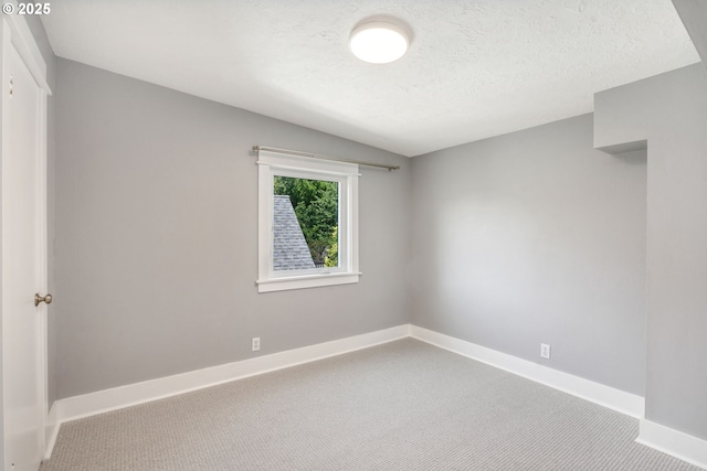 6126 SE 23rd Ave, Portland, OR 97202 - carpeted spare room with baseboards and a textured ceiling