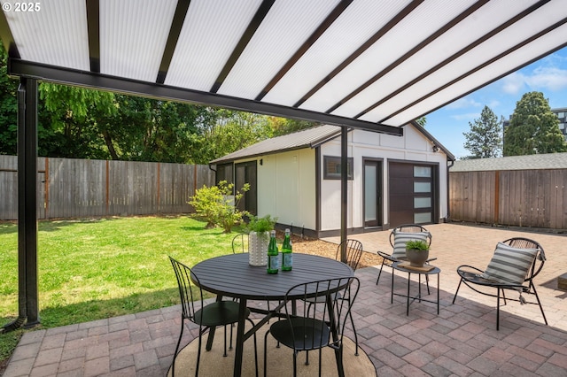 6126 SE 23rd Ave, Portland, OR 97202 - fenced backyard with an outbuilding, a patio area, and outdoor dining area