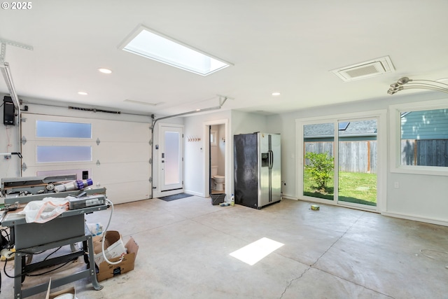 6126 SE 23rd Ave, Portland, OR 97202 - garage featuring stainless steel fridge with ice dispenser and recessed lighting