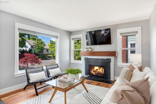 6126 SE 23rd Ave, Portland, OR 97202 - living area featuring a fireplace with flush hearth and wood finished floors