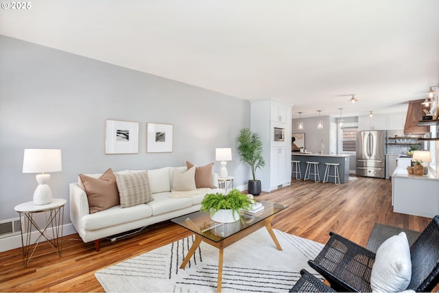 6126 SE 23rd Ave, Portland, OR 97202 - living room with light wood-style flooring and baseboards