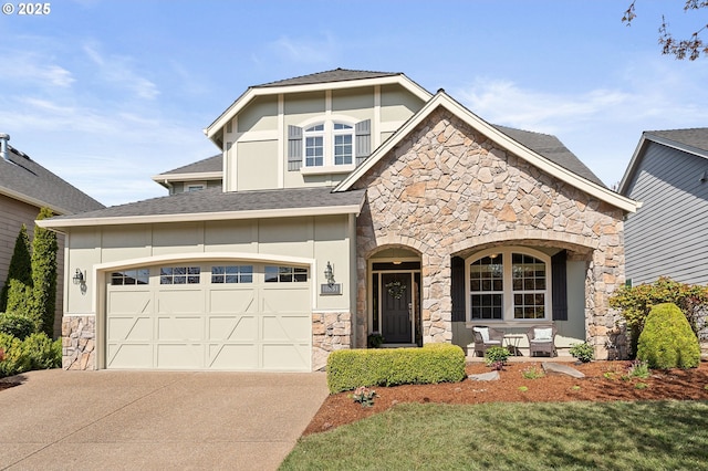 view of front of property with driveway, stucco siding, stone siding, and covered porch