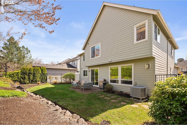 back of house with a lawn, a patio area, fence, and central AC