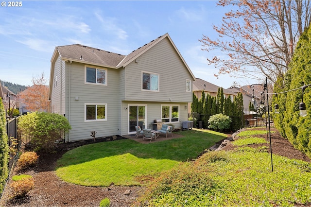 rear view of property featuring a patio, fence, central AC, and a lawn