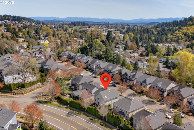 birds eye view of property featuring a mountain view and a residential view
