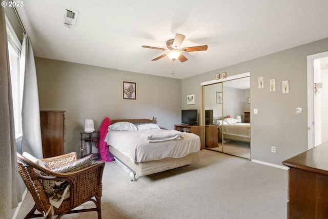 13810 NE 89th Cir, Vancouver, WA 98682 - bedroom featuring light carpet, a closet, a ceiling fan, and baseboards