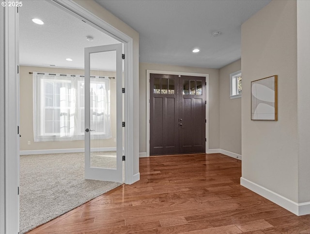 doorway featuring hardwood / wood-style flooring and french doors