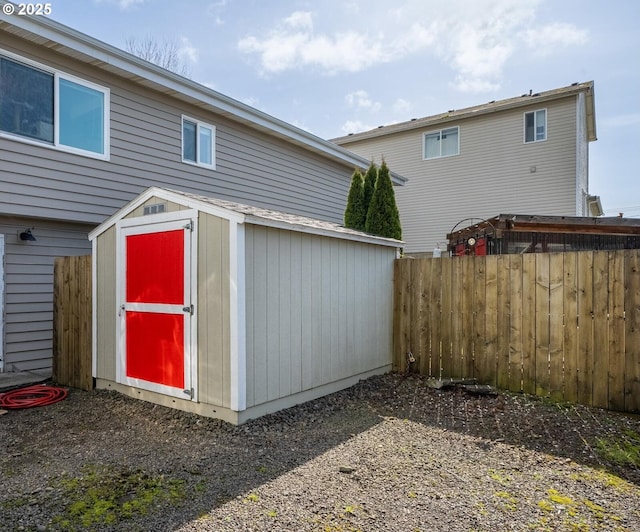 view of shed with fence