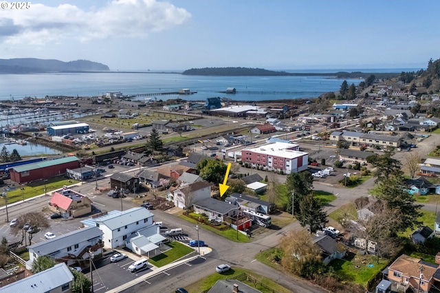 birds eye view of property featuring a water view