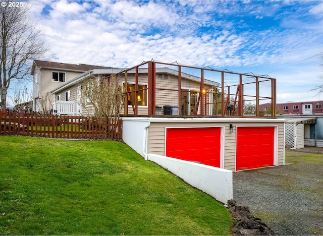 exterior space with a lawn and fence