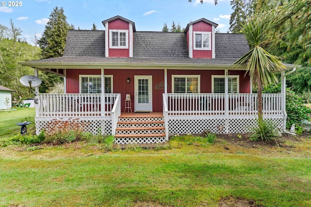 1042 W State Route 4, Cathlamet, WA 98612 - view of front of house with roof with shingles, a porch, and a front yard