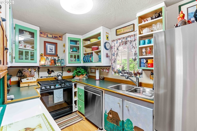 1042 W State Route 4, Cathlamet, WA 98612 - kitchen with open shelves, a textured ceiling, a sink, light wood finished floors, and appliances with stainless steel finishes