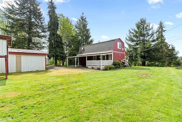 1042 W State Route 4, Cathlamet, WA 98612 - back of property featuring a lawn, an outbuilding, and a gambrel roof