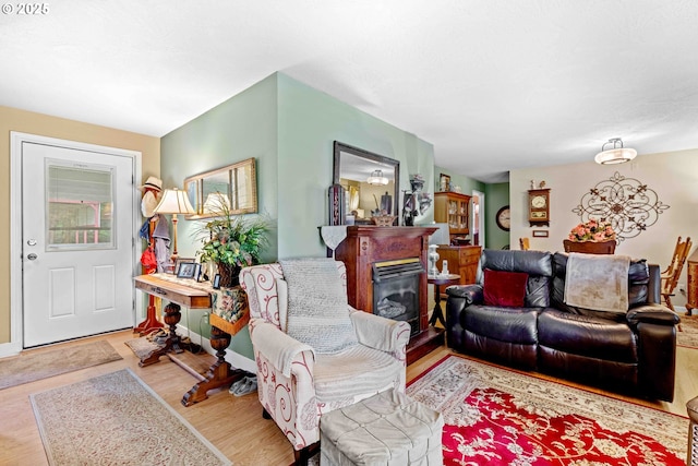 1042 W State Route 4, Cathlamet, WA 98612 - living room with a glass covered fireplace and wood finished floors