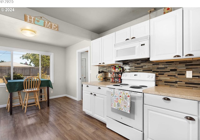 kitchen with decorative backsplash, white appliances, and white cabinetry