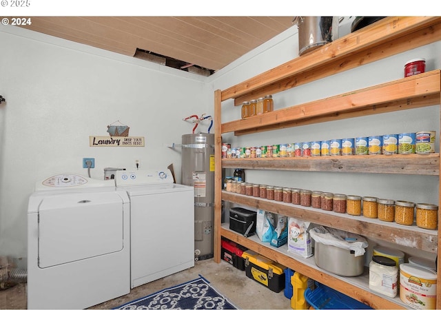 clothes washing area with water heater and separate washer and dryer