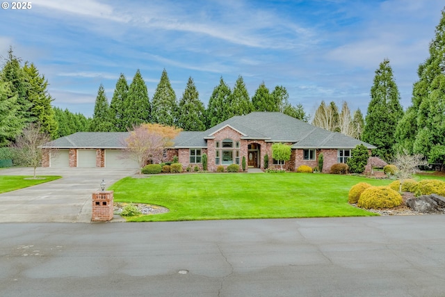 view of front facade featuring brick siding, a front lawn, a garage, and concrete driveway