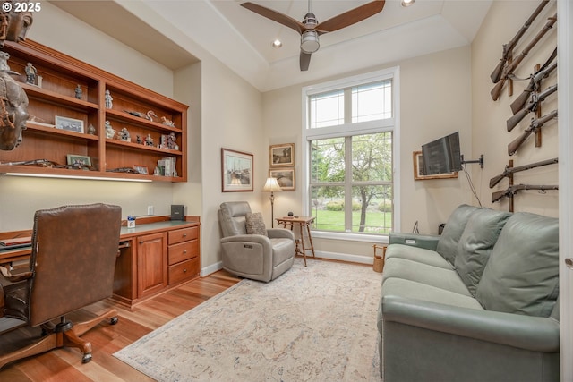 home office with baseboards, recessed lighting, light wood-type flooring, and a ceiling fan