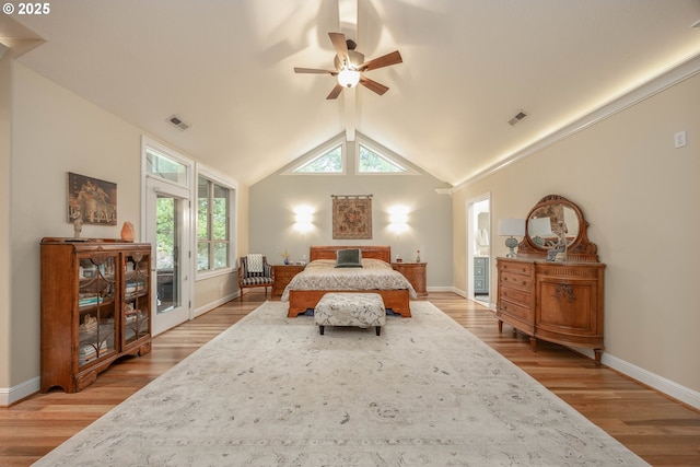 bedroom with lofted ceiling, access to outside, visible vents, and light wood-style flooring