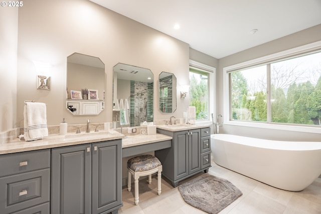 bathroom featuring a shower, two vanities, a sink, and a soaking tub