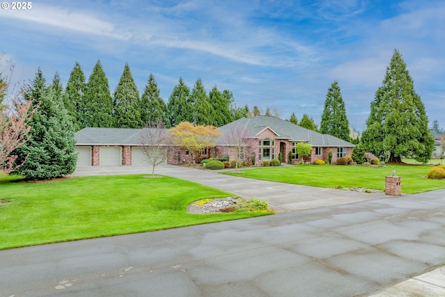 ranch-style house featuring a front yard, an attached garage, brick siding, and driveway