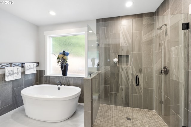 16290 SE Eckert Ln, Damascus, OR 97089 - full bathroom with tile walls, a shower stall, a freestanding bath, recessed lighting, and wainscoting