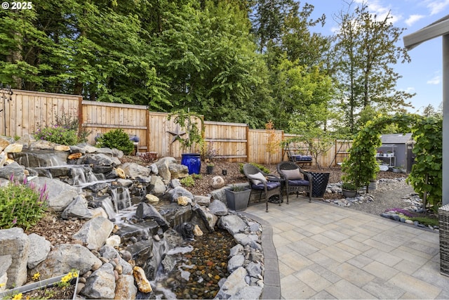 16290 SE Eckert Ln, Damascus, OR 97089 - fenced backyard featuring a patio area