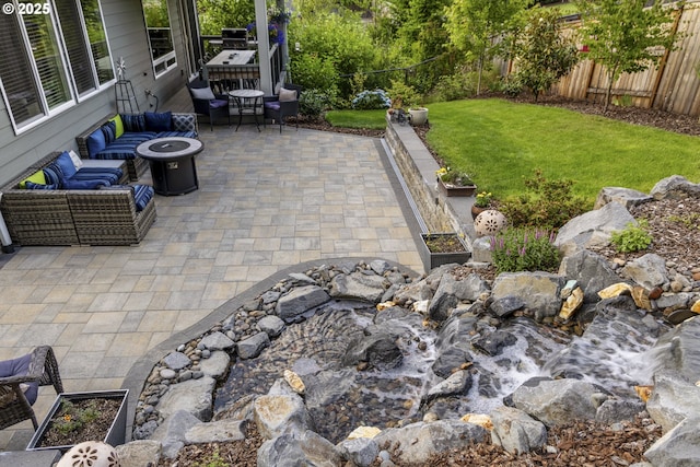 16290 SE Eckert Ln, Damascus, OR 97089 - fenced backyard with a patio area and an outdoor living space with a fire pit