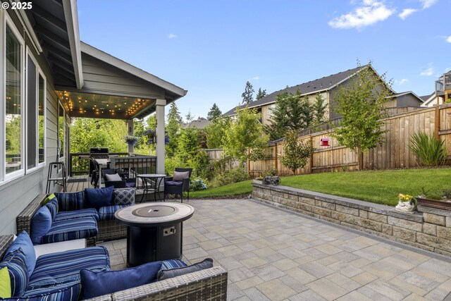 16290 SE Eckert Ln, Damascus, OR 97089 - fenced backyard with an outdoor living space with a fire pit and a patio