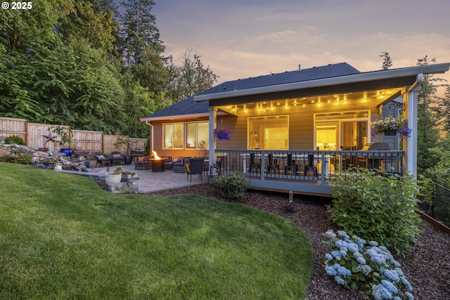 16290 SE Eckert Ln, Damascus, OR 97089 - rear view of house with a patio area, an outdoor fire pit, and a shingled roof