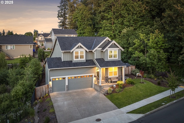 16290 SE Eckert Ln, Damascus, OR 97089 - craftsman-style house with board and batten siding, stone siding, concrete driveway, an attached garage, and a porch