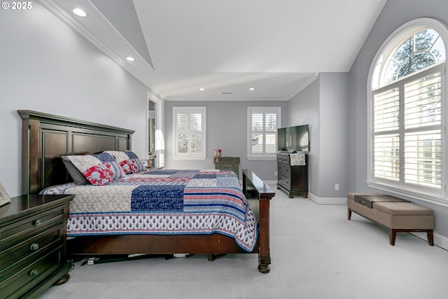 bedroom featuring crown molding, light colored carpet, and vaulted ceiling