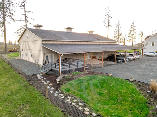 view of side of home featuring a yard