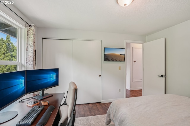 16318 SW Wright St, Beaverton, OR 97007 - bedroom with wood finished floors, a closet, and an office area