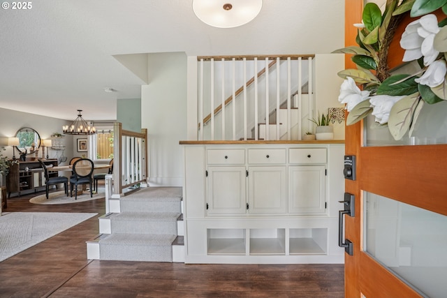 16318 SW Wright St, Beaverton, OR 97007 - staircase featuring a chandelier and wood finished floors