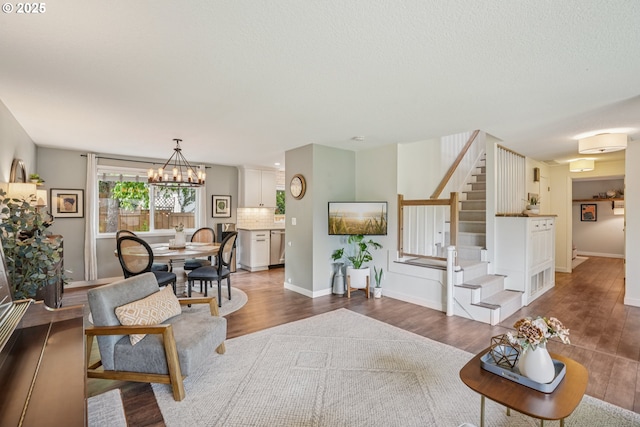 16318 SW Wright St, Beaverton, OR 97007 - living room with stairway, dark wood finished floors, and a chandelier