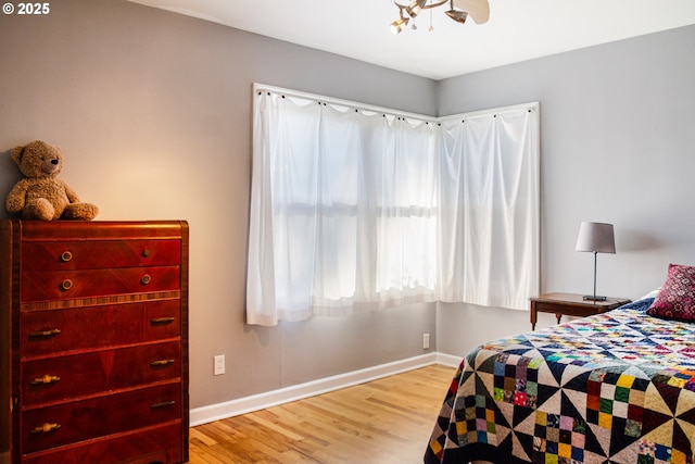2445 SE 76th Ave, Portland, OR 97206 - bedroom with baseboards and wood finished floors