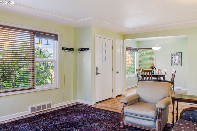 2445 SE 76th Ave, Portland, OR 97206 - foyer featuring plenty of natural light, baseboards, and wood finished floors