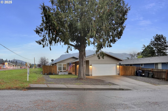 view of front facade with a garage and a front lawn