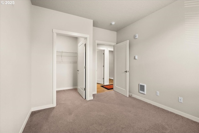17149 SW Snowdale St Unit 203, Beaverton, OR 97007 - unfurnished bedroom with carpet, baseboards, a spacious closet, and a closet