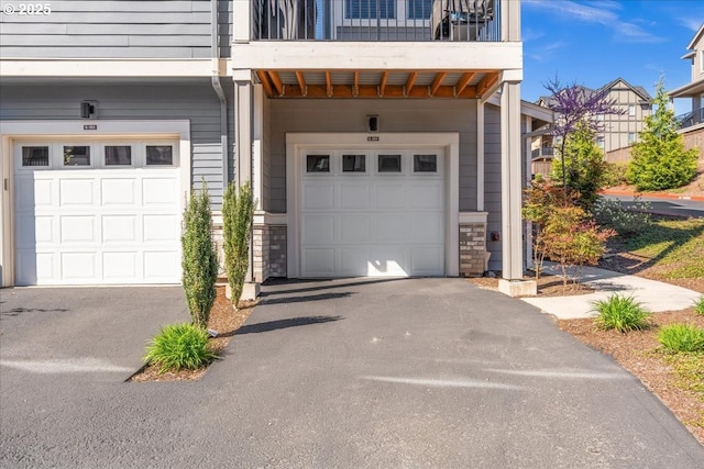 garage with asphalt driveway