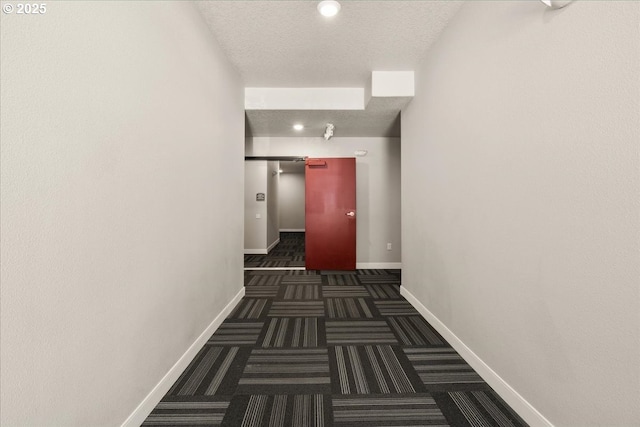 17149 SW Snowdale St Unit 203, Beaverton, OR 97007 - hallway with baseboards, a textured ceiling, carpet, and recessed lighting